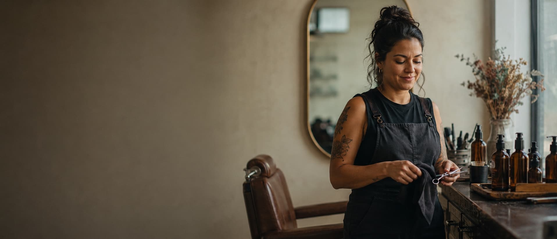 Beauty professional at her station between clients